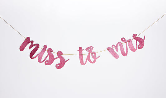 Banner "Miss to Mrs." de color rosa con tipo escarcha