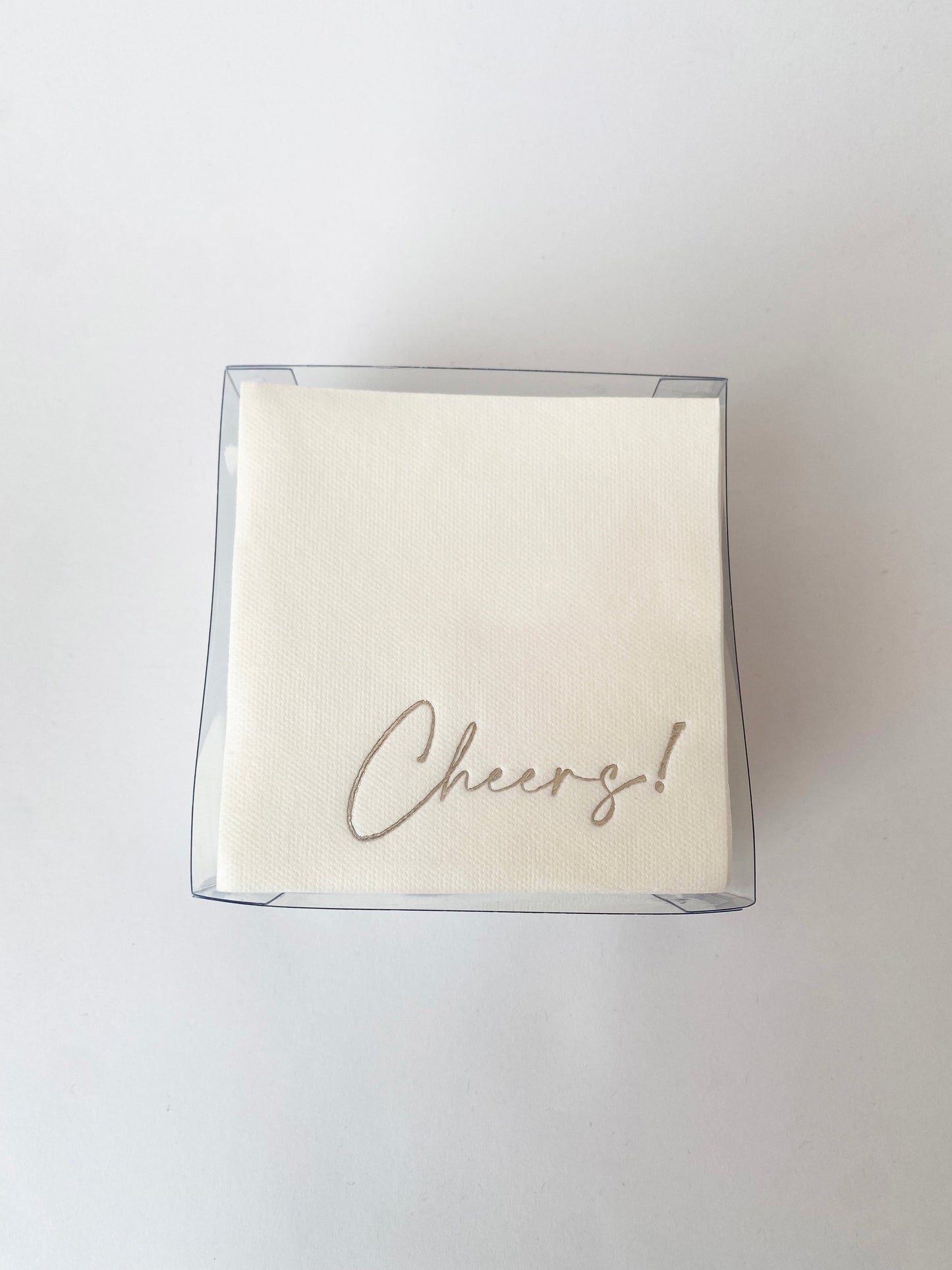 Servilletas cocteleras blancas con letras en foil plateado "Cheers!"