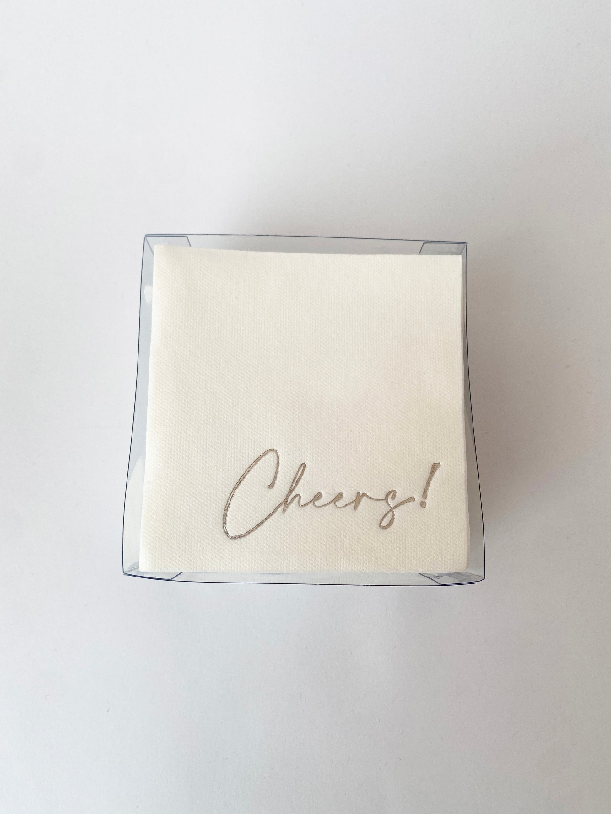 Servilletas cocteleras blancas con letras en foil plateado "Cheers!"