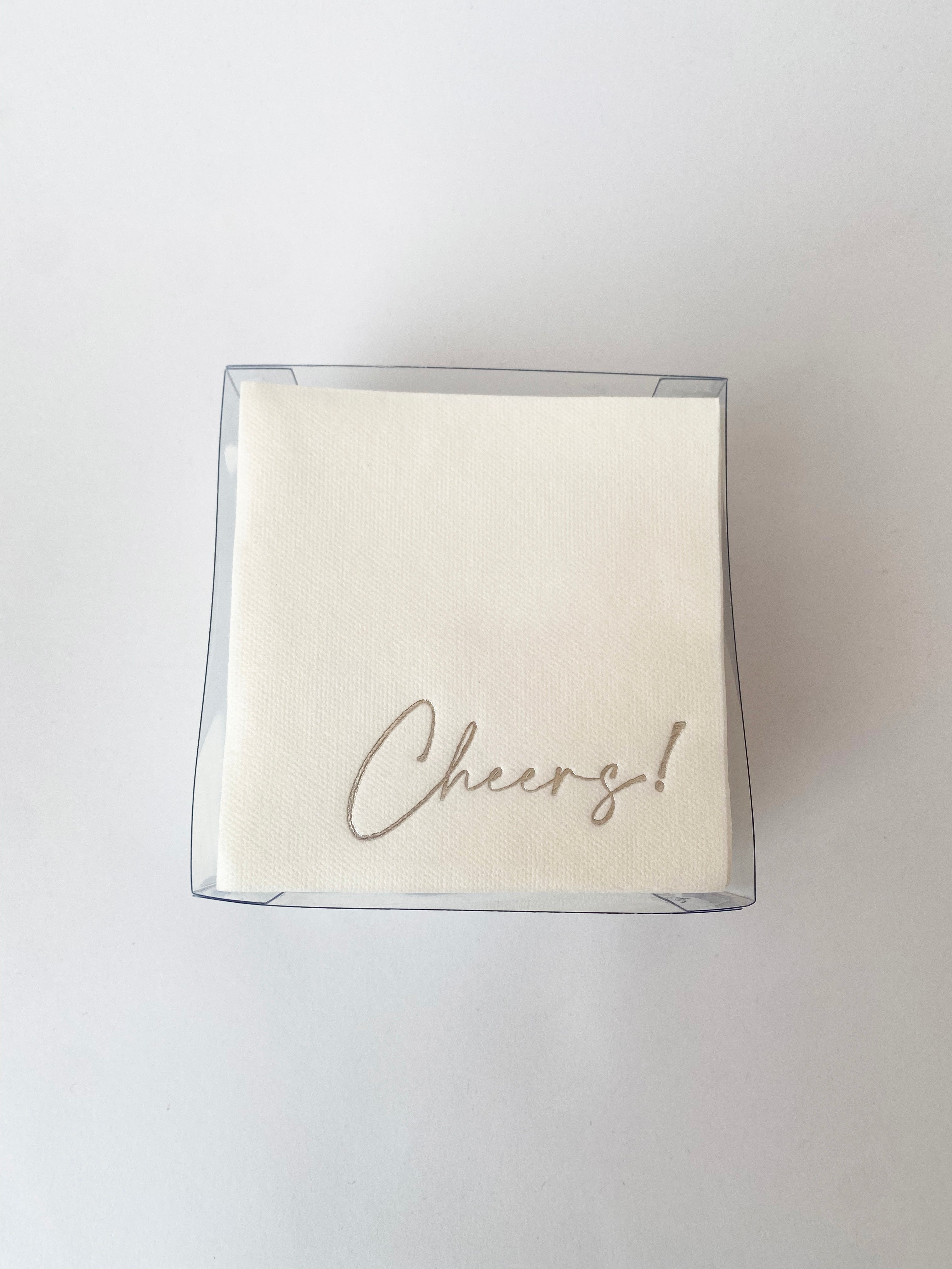 Servilletas cocteleras blancas con letras en foil plateado "Cheers!"